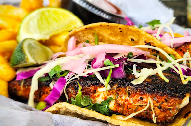 Ocean Grill & Tiki Bar signature dishes Shrimp or Oyster Roll
Fish Tacos
Calabash Platter